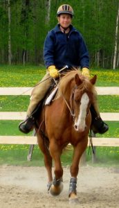 Birgit riding a training horse