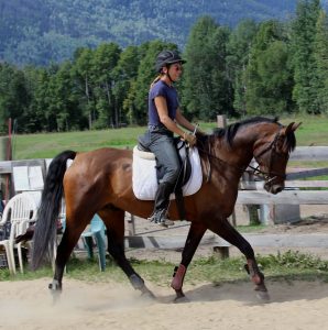 Birgit rides one of the training horses