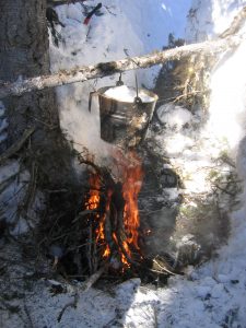 Melting snow over the campfire